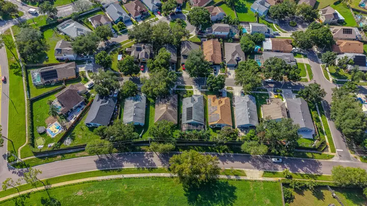Aerial view of a neighborhood block of homes