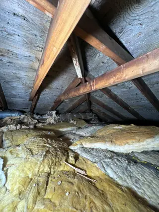 Insulation between rafters in an attic