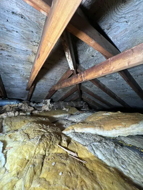 Insulation between rafters in an attic